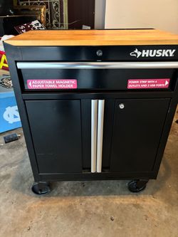2 Husky work benches with power strips $100 Each