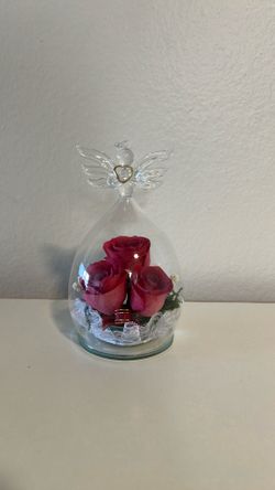 Rose in angel glass