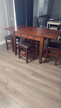 Cherry wood counter height kitchen table with 4 stools
