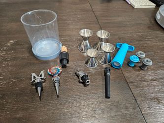 Assorted Wine Stops & Drink Measurements Cups