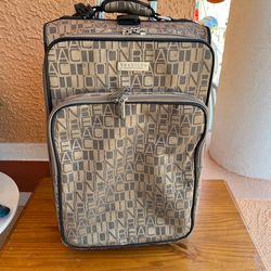 Clean, medium-sized, two-wheeled suitcase in good condition. It measures 21 inches high, 14 inches wide, and 9 inches deep.
