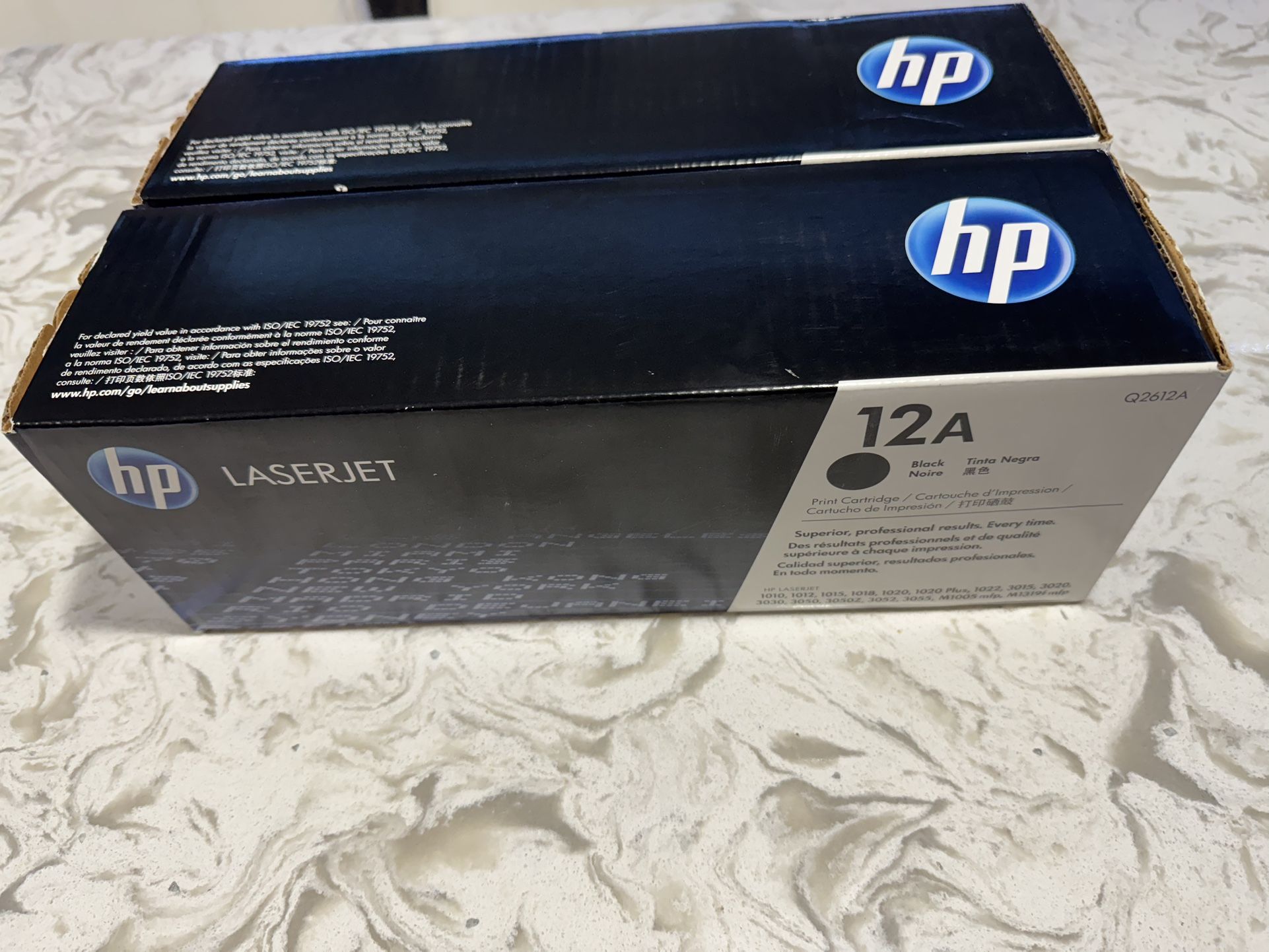 Two HP LaserJet 12A toner cartridges are available