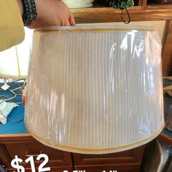 New White lampshade with gold trim
8.5"h x 14"w
Still in plastic