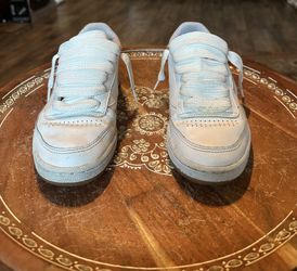 All white classic Reebok shoes With A Gum Bottom