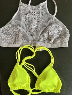 Elegant gray lace bralette with intricate design. Vibrant neon yellow bikini top with braided straps.