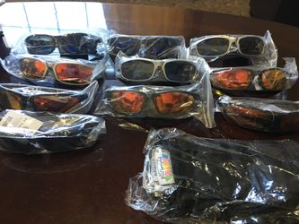 Brand new never used Polarized glare blocking eyewear with covers I have 10 pairs each for $40