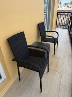 Set of two wicker chairs and table w glass top
