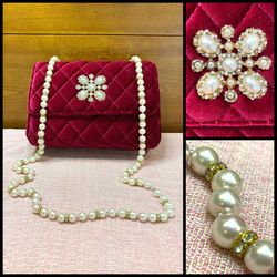 Sondra Robert’s quilted red velvet bag amazing faux pearl and rhinestone strap. Like new! Has a beautiful antique looking brooch attached on the front