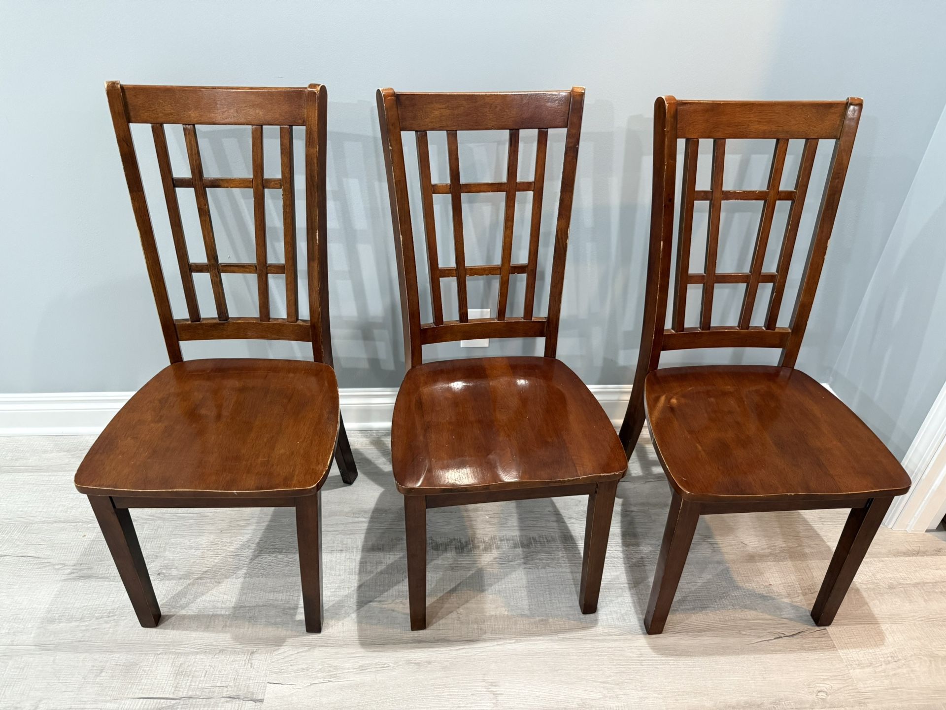 3 wooden chairs and 1 table