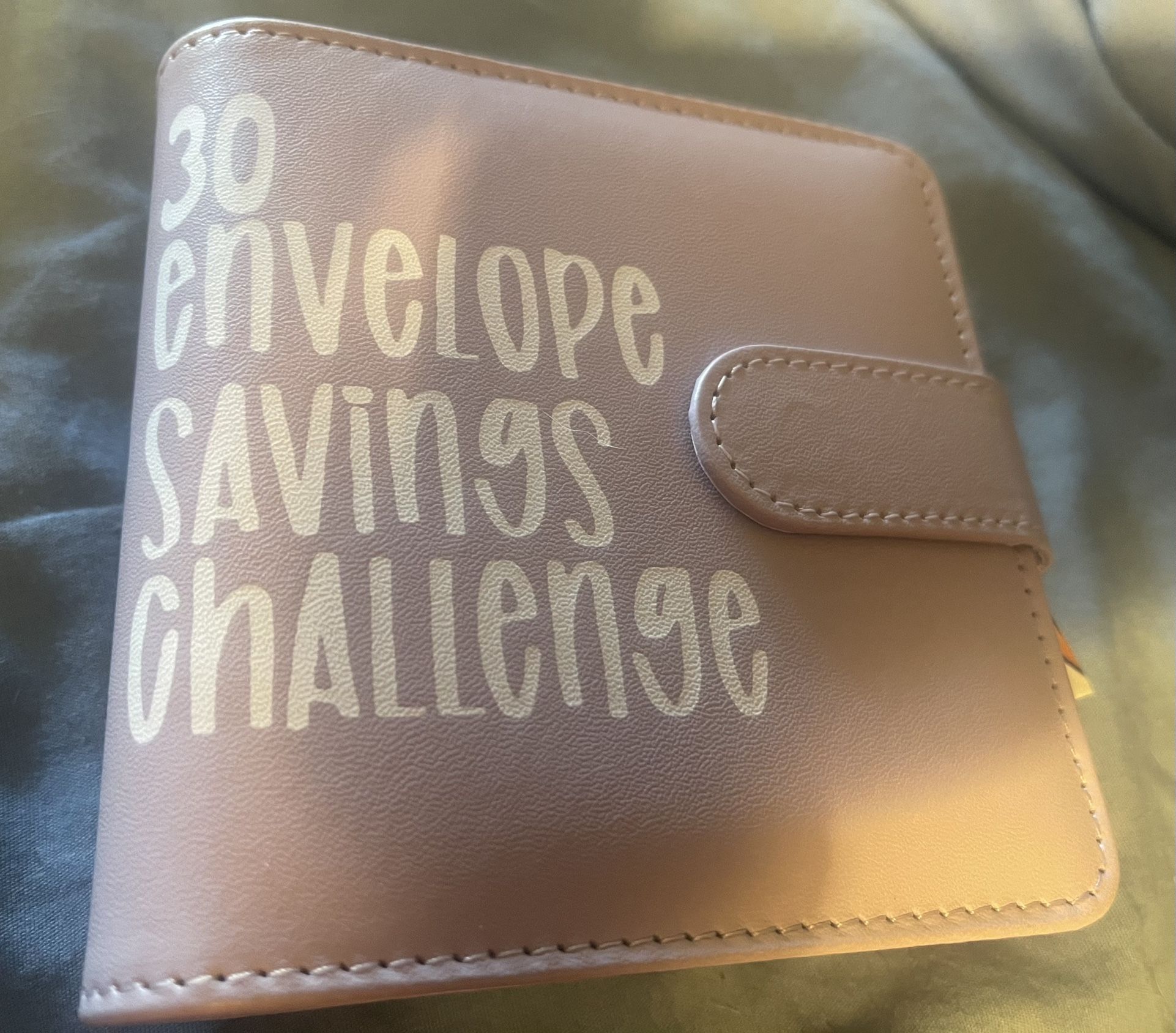 This is a 30-envelope challenge binder designed to help save $5,050