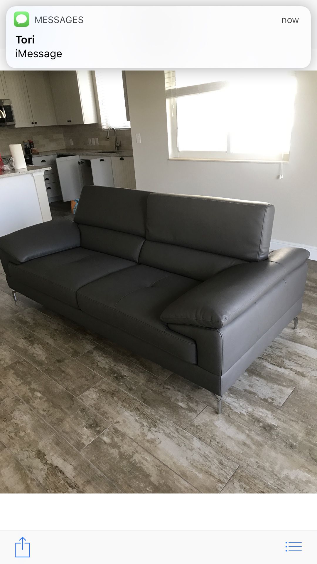Grey leather love seat couch