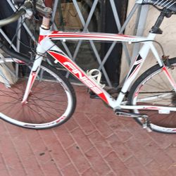 The bicycle in the image is a Merax Finiss Aluminum 21-Speed 700C Road Bike. 