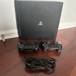 PlayStation 4 Pro 1TB + 2 Controllers – Excellent Condition, Well Maintained