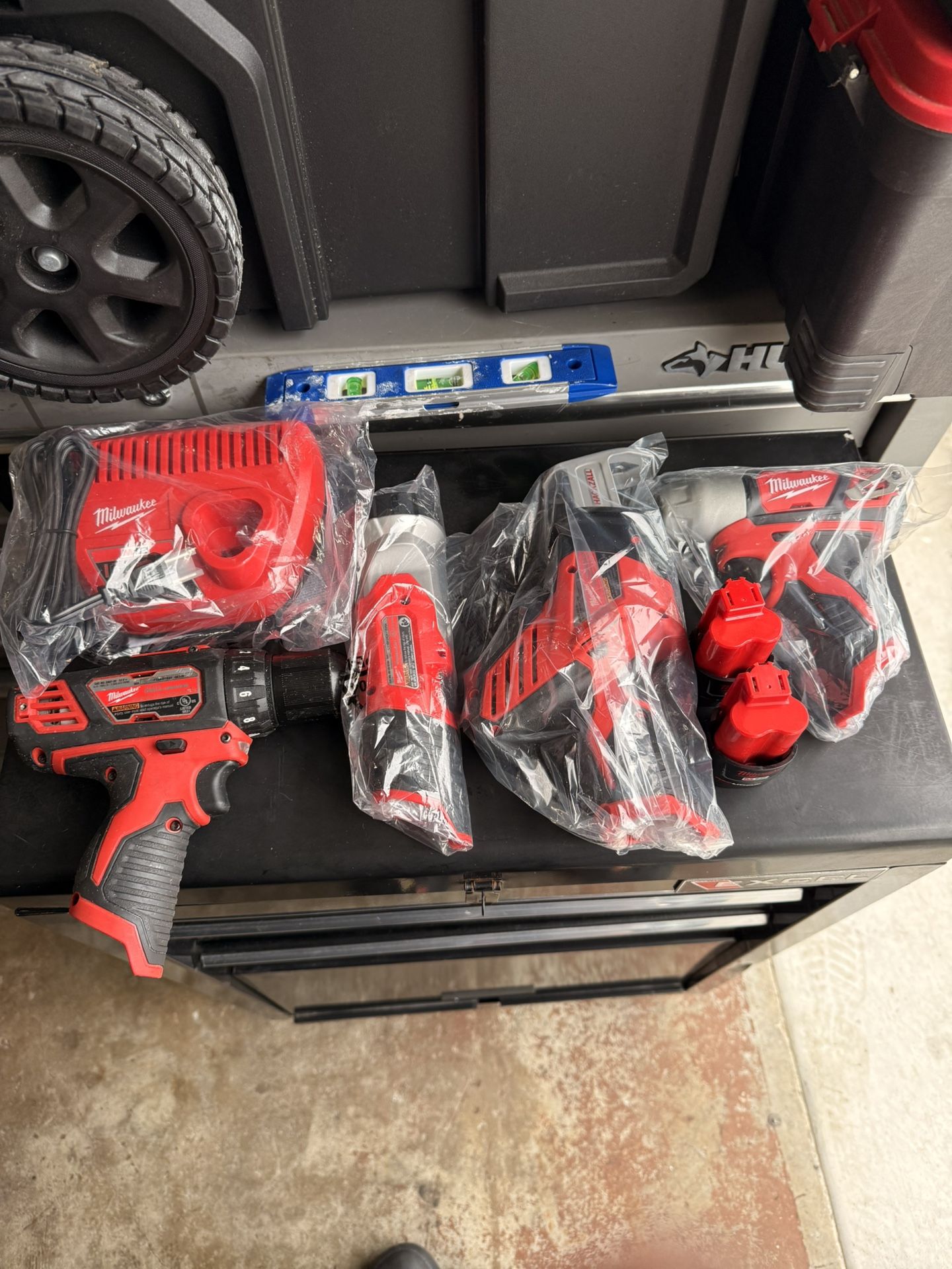 Milwaukee Drill, Impact Drill, Compact Light With Magnet, Reciprocating Saw, Two Batteries Charger And Tool Bag 