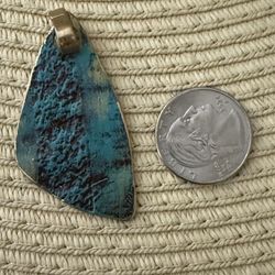 Blue Marblelike Stone On Gold Pendant