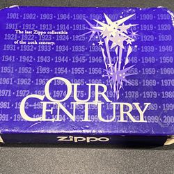 Zippo "Our Century" 1999 Collectible of the Year Lighter in Tin w Papers. Pewter needs a good polish. Tiny dent in upper left corner of the tin. Lid a