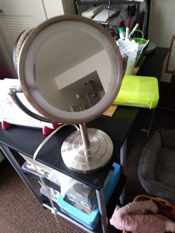 Makeup mirror. Magnifying on one side regular on the other. Nice weight to it and light it