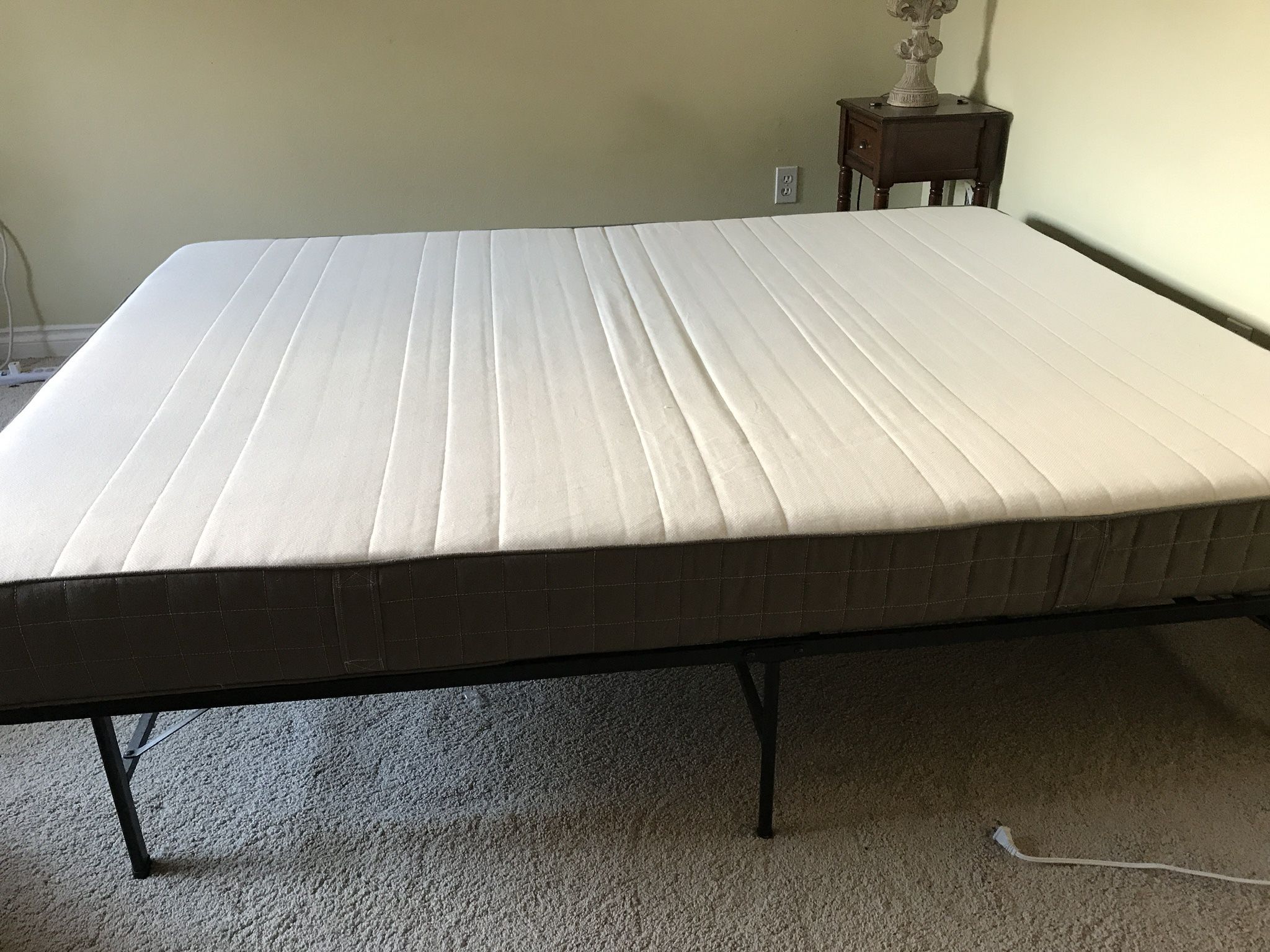 Queen-size mattress with bed frame