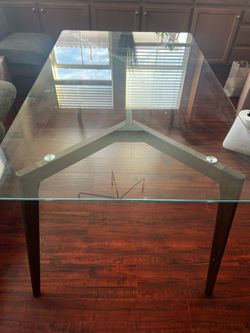 Beautiful Glass dining table with wood legs