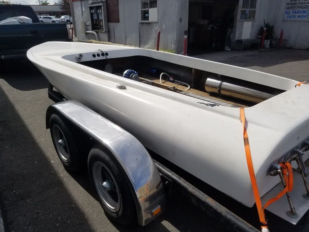 Flat bottom Sanger boat, V drive with dual axle trailer