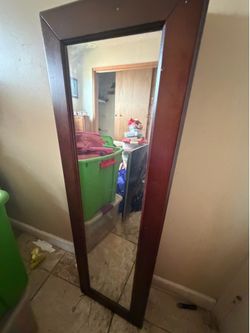 Mirror with jewelry holder
