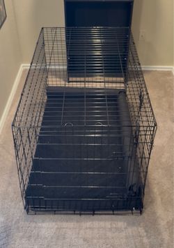Large wire dog crate and dog bed