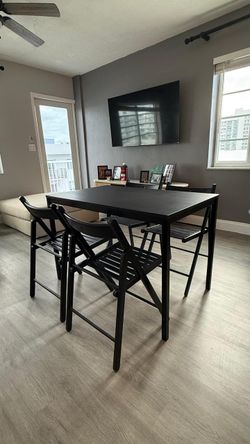 Black Dining Table with 4 Folding Chairs