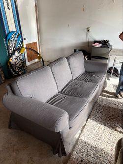 Lots of cheap stuff (couch, rug, coffee table, storage shelf)