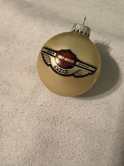 Harley Davidson Centennial Ornament (100 years) Some wear on the sheen of the ornament and has original package that’s damaged but still intact.