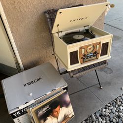 VICTROLA.   Record Player  CD. ..CASSETTE    BLUETOOTH.     RADIO. AM. FM.   like new Conditions.   plus. 10 Records Of Julio Iglesias.   Asking $130 