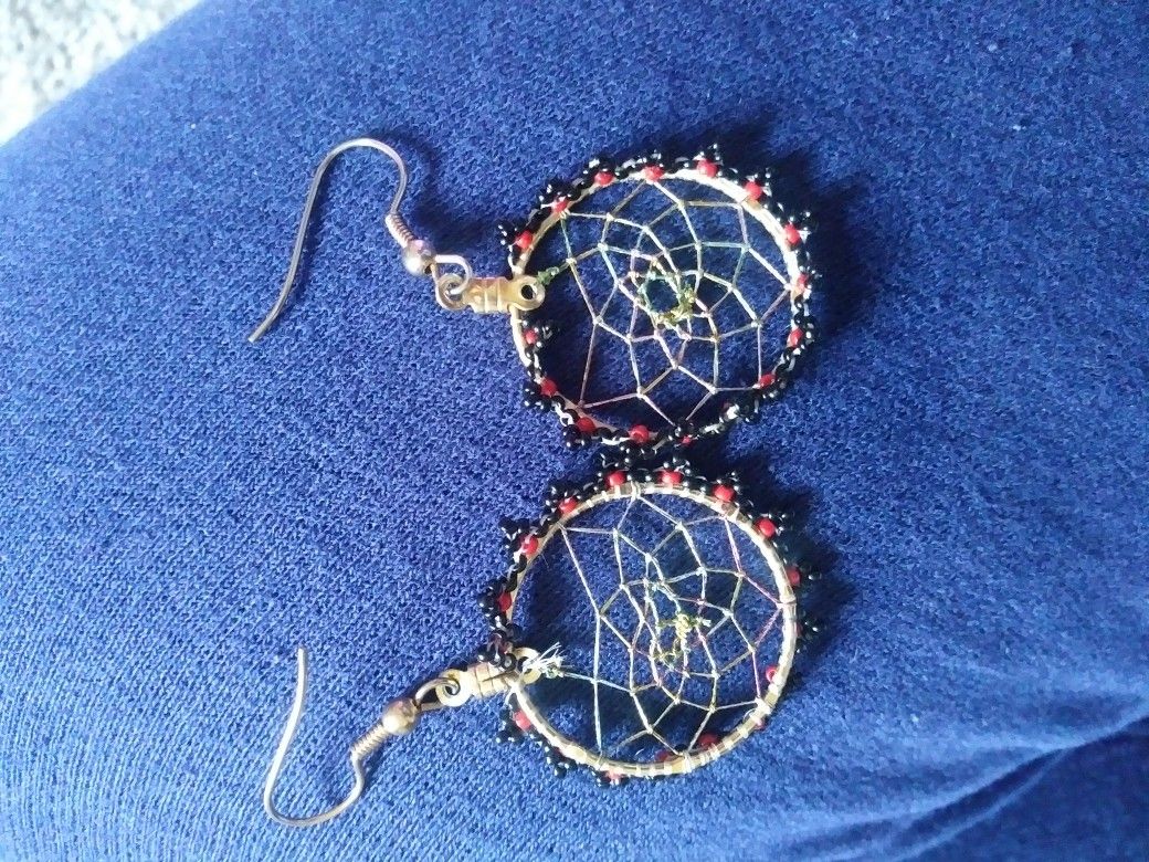 A pair of dream catcher earrings