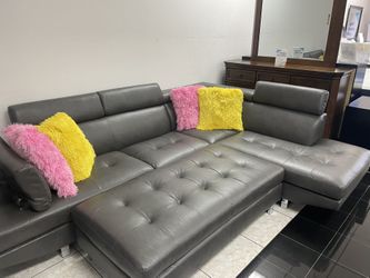 Sleek Gray Sectional With Ottoman
