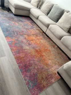 Sectional couch and area rug