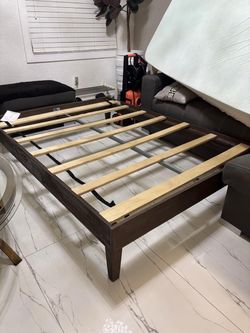 Full size bed frame in dark wood. NO MATTRESS! Only frame