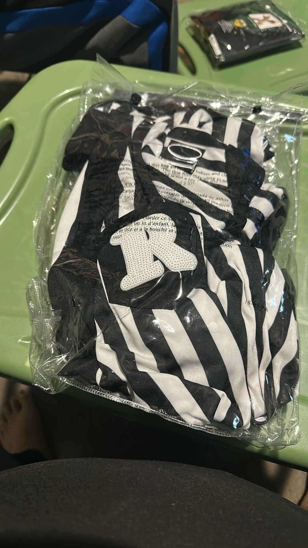 A Referee Dress With The Hat And Whistle To Blow