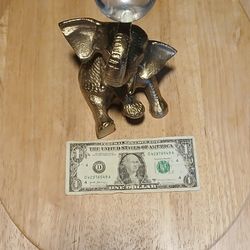 Elephant Holding Crystal Ball