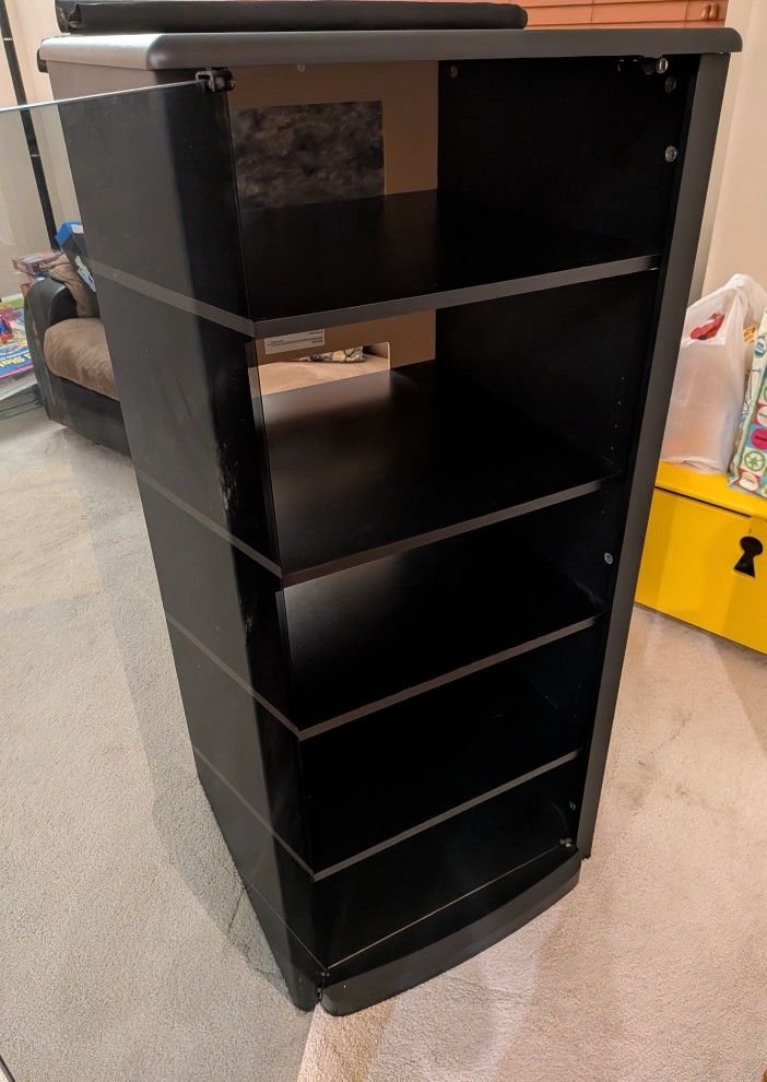 Black Media cabinet or entertainment stand with adjustable shelves and a glass door.