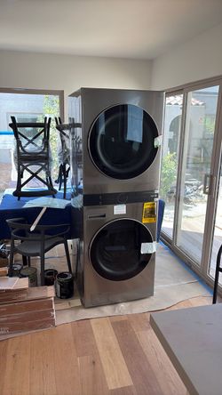 NEW LG 4.5 ft.³ front load HE washer dryer