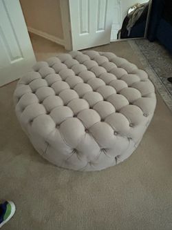 Gray round ottoman