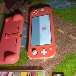 Pink Nintendo Switch Lite with Dragons and Splatoon 2