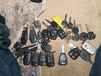 13 key fobs and old car keys