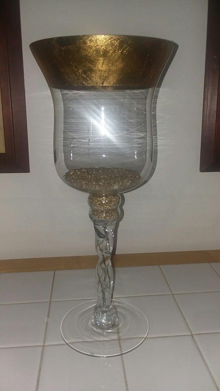 Tall vase w/gold colored rim and gold colored nuggets nside.