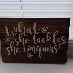 Small Wooden Plaque "What She Tackles She Conquers"