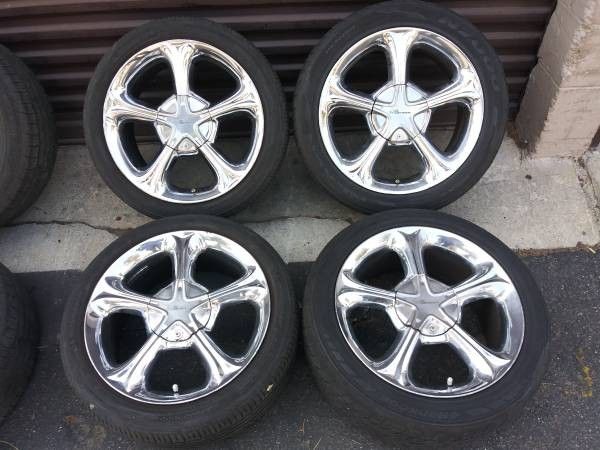 set of 5 lug multipattern 17 inch chrome rims with tires.