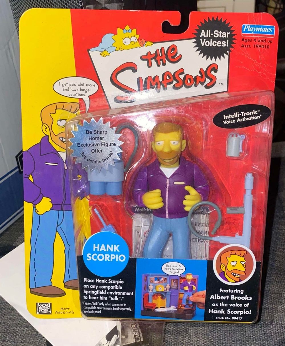 Selling a brand-new, sealed The Simpsons Hank Scorpio action figure from the World of Springfield series by Playmates. Package is in great shape, bubb