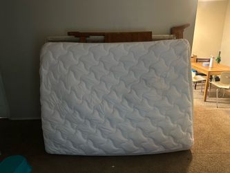 Queen size bed with wooden frame
