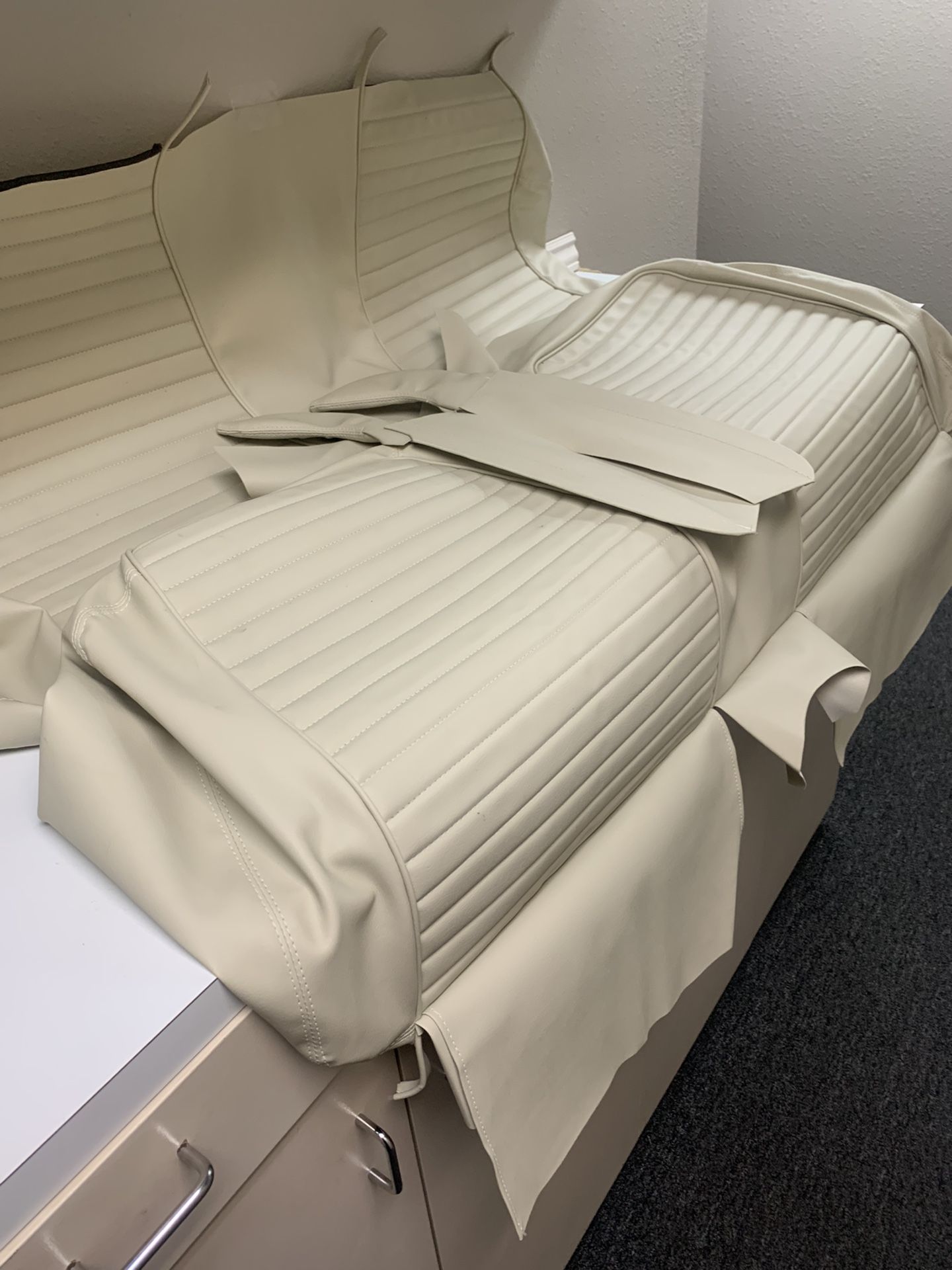 White ‘57 Ford Seat Cover.