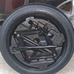NEW SPARE TIRE WITH JACK KIT