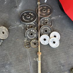 250lbs of Olympic weights with 7ft 45lbs bar