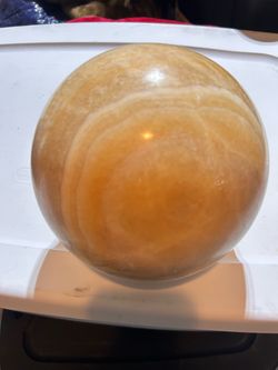 15+-pound banded yellow/orange calcite sphere